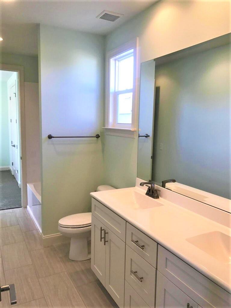 148 Chapman Street Santa Rosa Beach, FL 32459 - Photo 13 of 23 a bathroom with a sink and a toilet