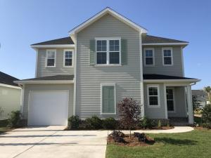 148 Chapman Street Santa Rosa Beach, FL 32459 - Photo 2 of 23 a front view of a house with a yard and garage