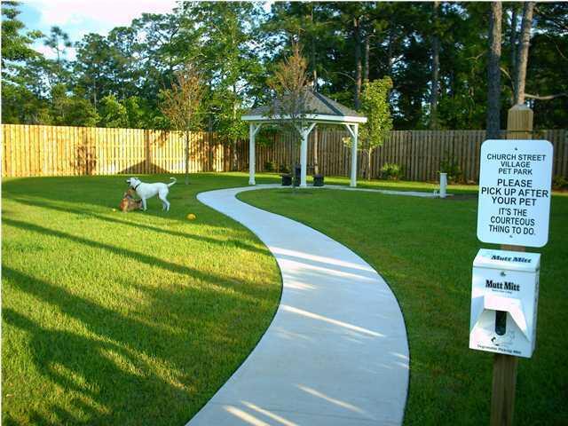 148 Chapman Street Santa Rosa Beach, FL 32459 - Photo 23 of 23 a view of a big house with a big yard and large trees