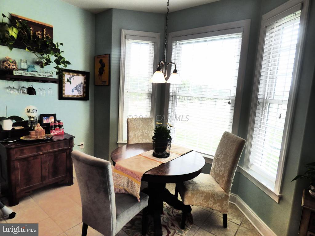 8737 Newark Road Newark, MD 21841 - Photo 22 of 54 a dining room with furniture and window