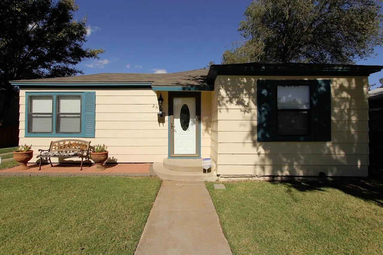a front view of a house with yard