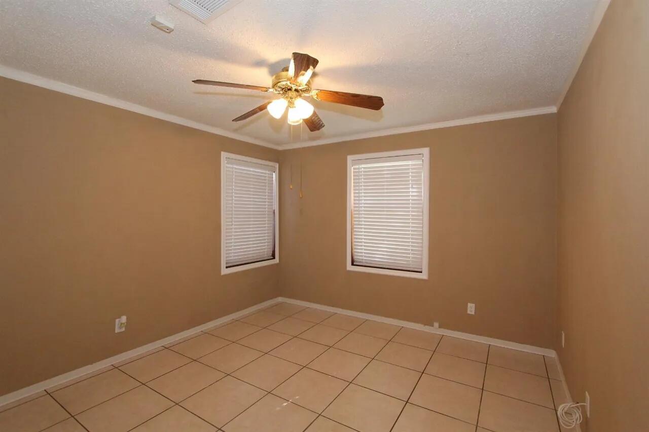 2610 35th Street Lubbock, TX 79410 - Photo 14 of 19 a view of an empty room with a window