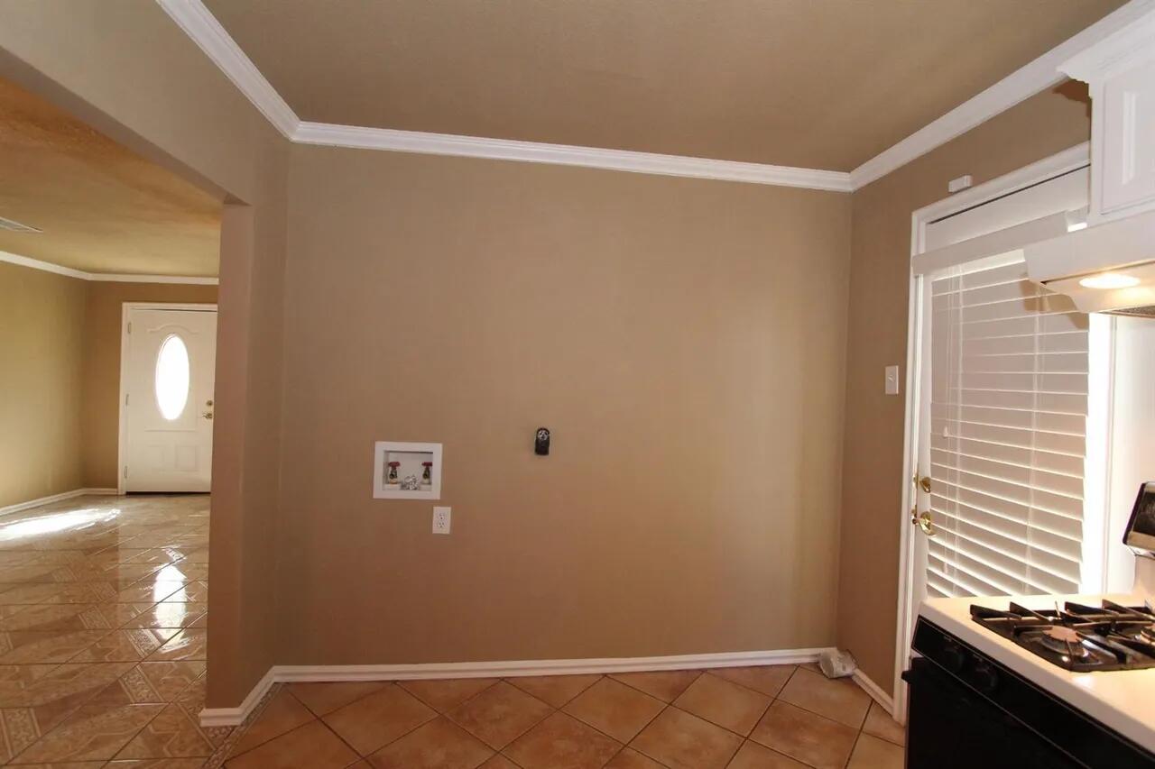 2610 35th Street Lubbock, TX 79410 - Photo 15 of 19 a view of a livingroom with wooden floor