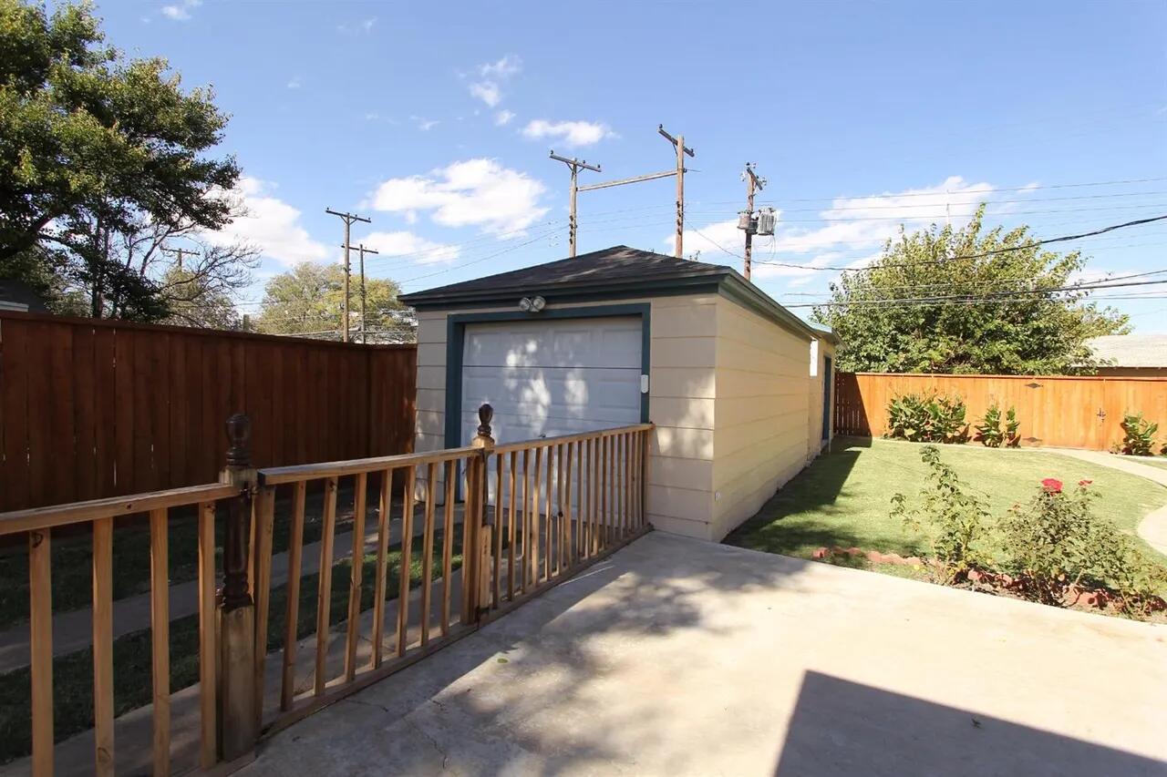 2610 35th Street Lubbock, TX 79410 - Photo 17 of 19 a view of a house with a yard