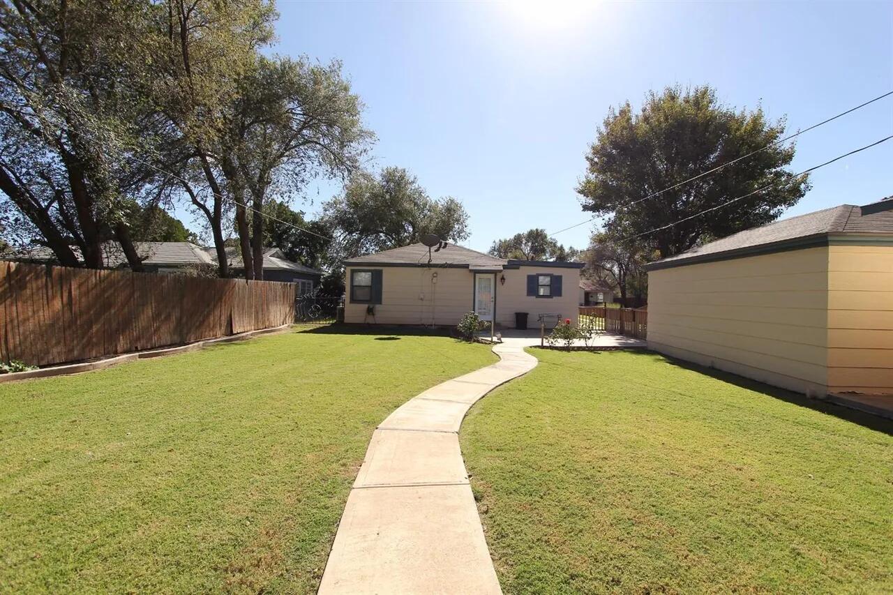 2610 35th Street Lubbock, TX 79410 - Photo 18 of 19 a house with swimming pool in front of it