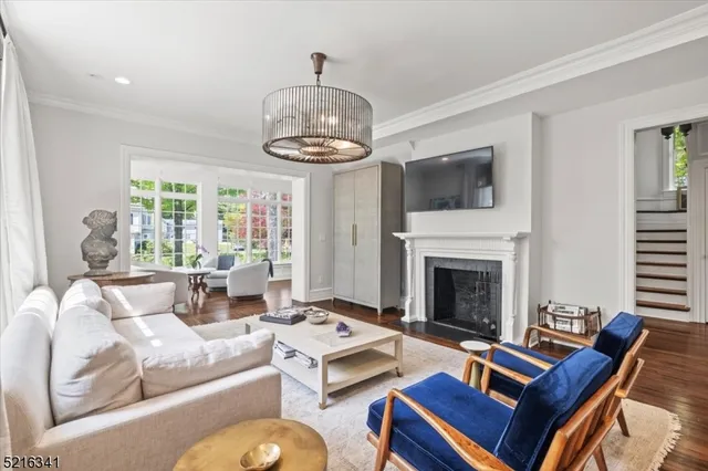 a living room with furniture fireplace and flat screen tv