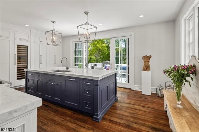 a kitchen with wooden floor and window