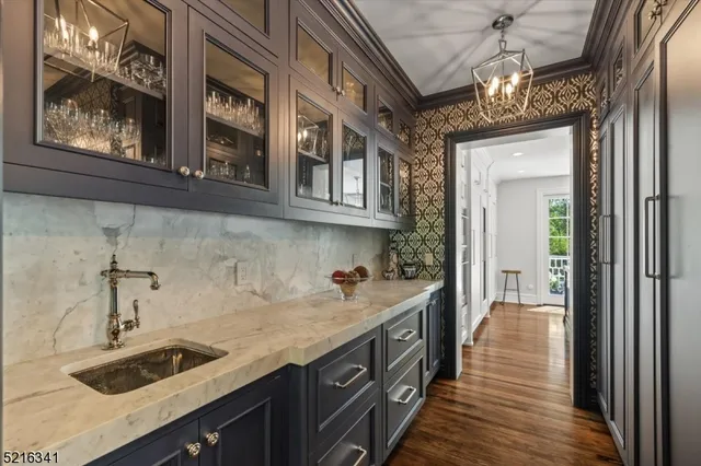 a kitchen with a sink and cabinets