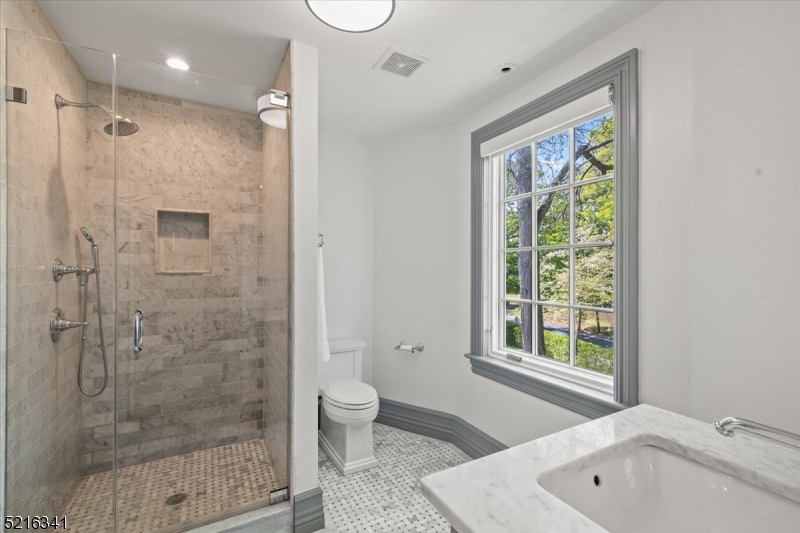 350 South Street, Unit 2 Morristown, NJ 07960 - Photo 27 of 36 a bathroom with a bathtub shower sink and toilet