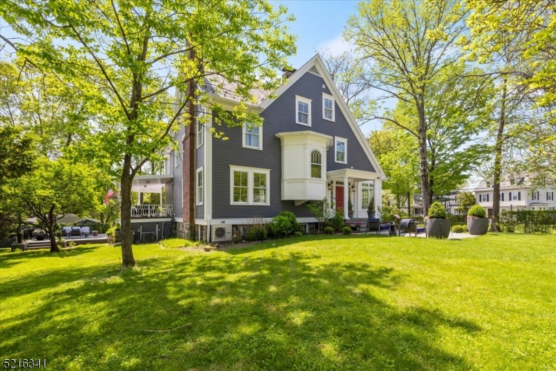 350 South Street, Unit 2 Morristown, NJ 07960 - Photo 3 of 36 a view of a house with a big yard and large trees