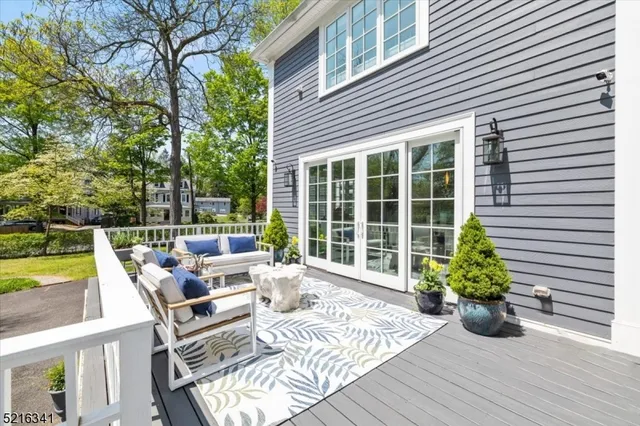 a view of a two chairs in the patio