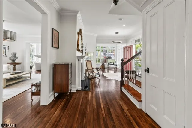 a view of entryway with livingroom and wooden floor