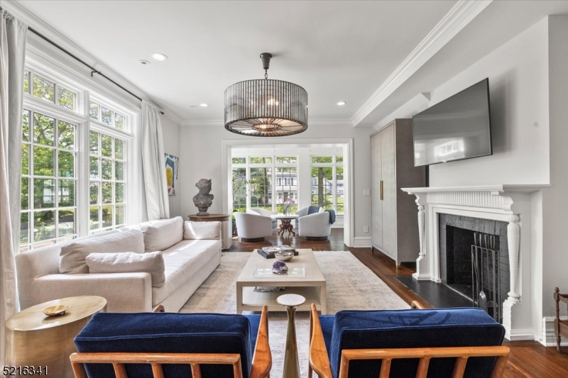 350 South Street, Unit 2 Morristown, NJ 07960 - Photo 10 of 36 a living room with furniture a fireplace and a flat screen tv