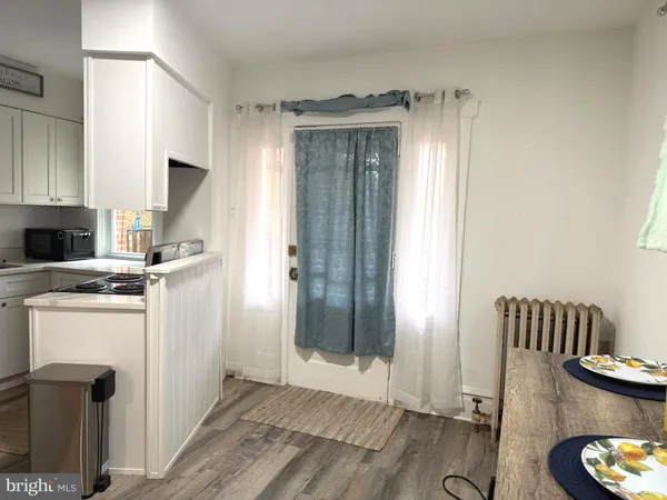 a kitchen with stainless steel appliances granite countertop a refrigerator and a stove