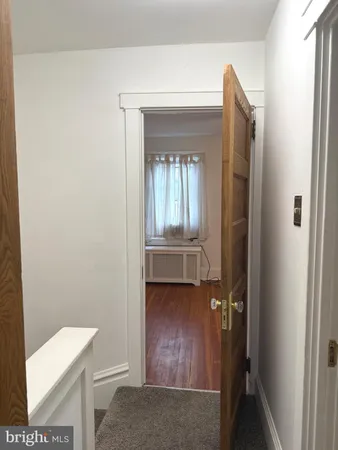 a view of hallway with mirror