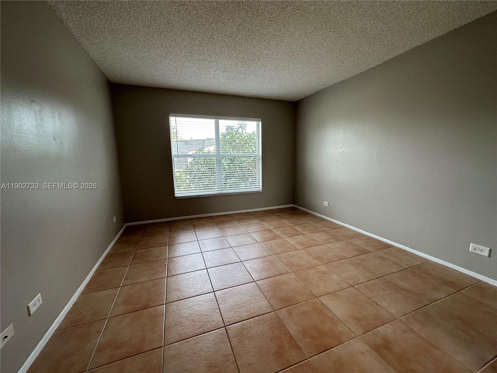 3650 Inverrary Drive, Unit 3YG Lauderhill, FL 33319 - Photo 15 of 28 a view of an empty room with a window