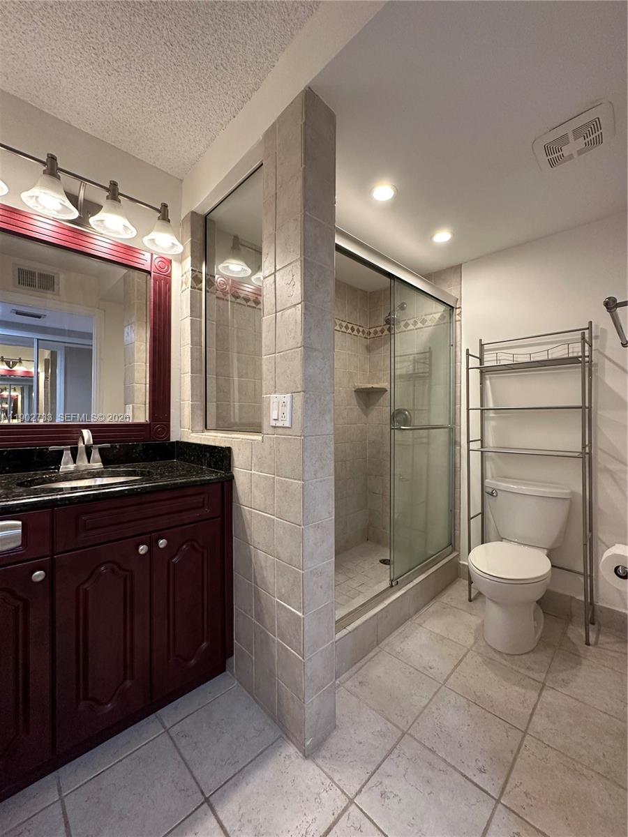 3650 Inverrary Drive, Unit 3YG Lauderhill, FL 33319 - Photo 19 of 28 a bathroom with a sink a toilet and shower