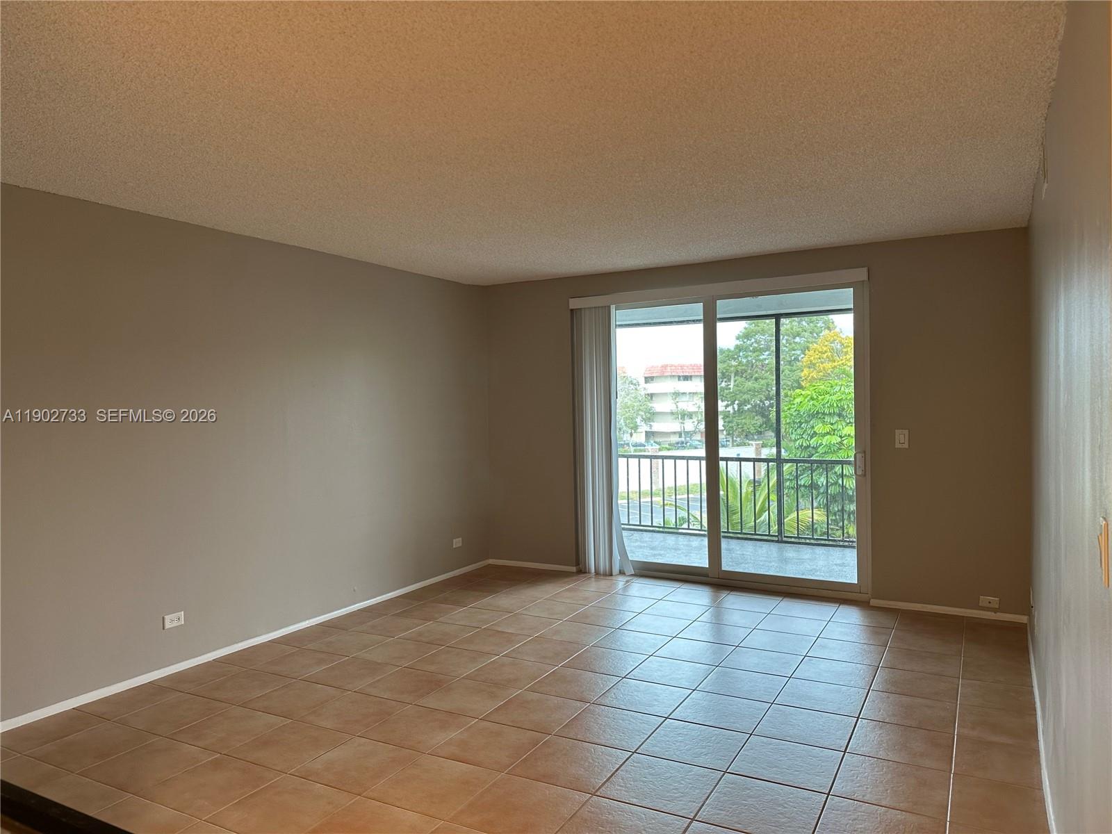 3650 Inverrary Drive, Unit 3YG Lauderhill, FL 33319 - Photo 2 of 30 a view of an empty room with a window
