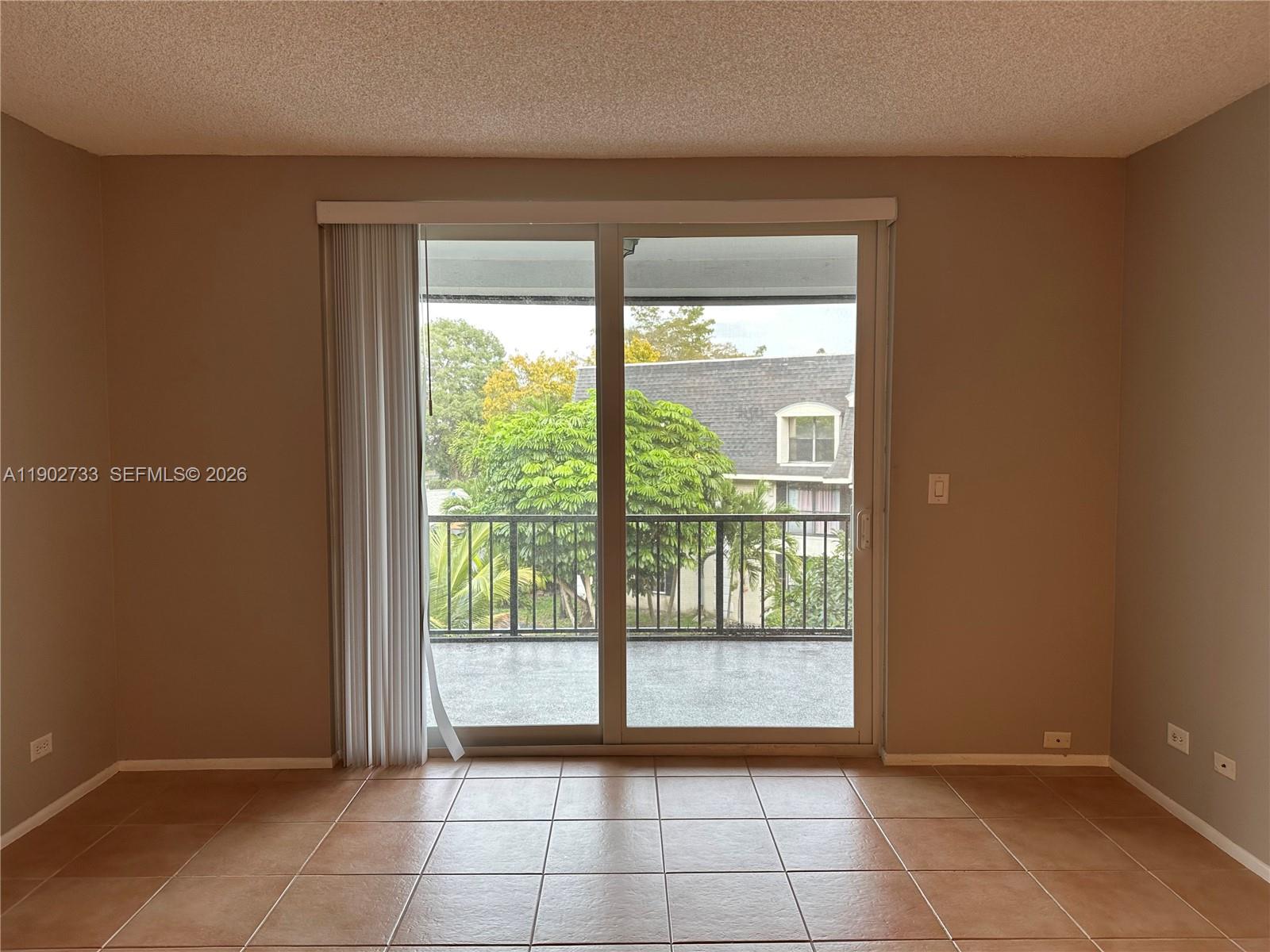 3650 Inverrary Drive, Unit 3YG Lauderhill, FL 33319 - Photo 3 of 30 a view of an empty room with a window