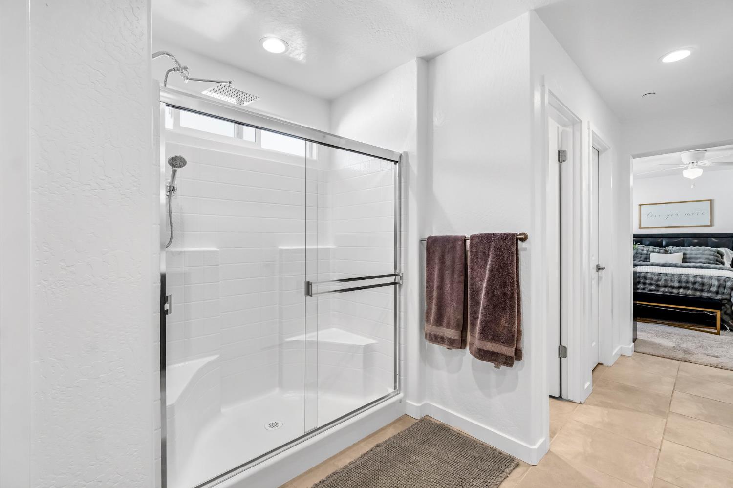 367 Talus Way South Madera, CA 93636 - Photo 30 of 40 a bathroom with a shower and a glass door
