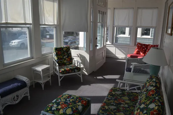 a living room with furniture a window and a table