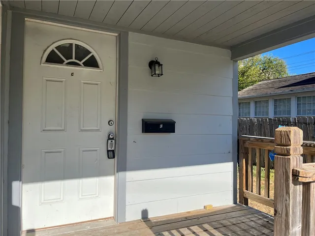 a bathroom with a window and a shower