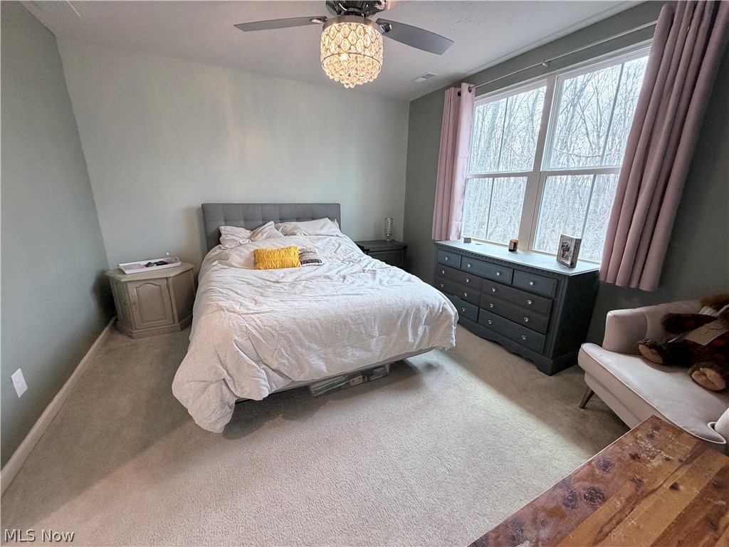 177 Raintree Lane Painesville, OH 44077 - Photo 16 of 40 Carpeted bedroom with baseboards and ceiling fan