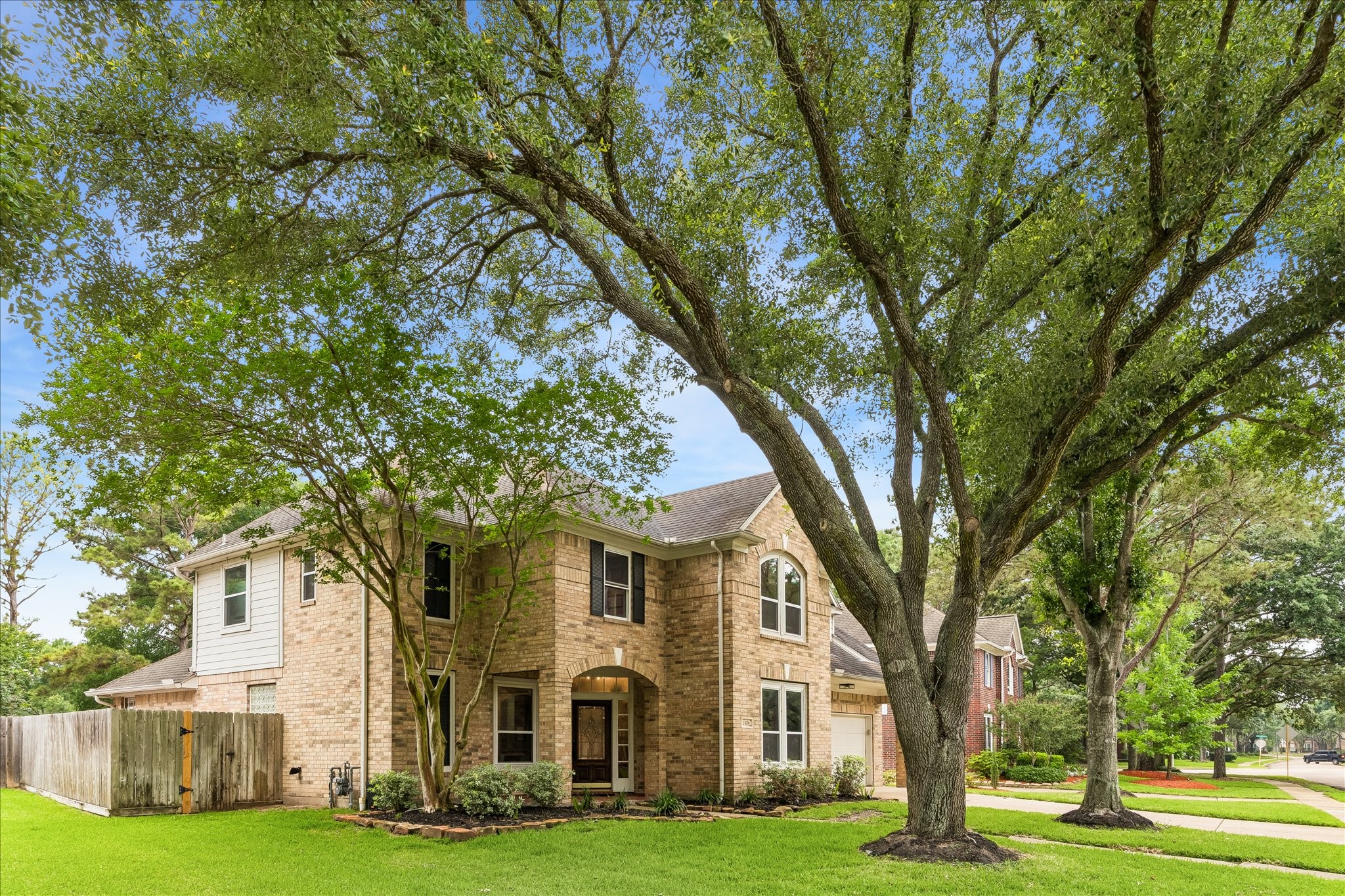 23039 Enchanted Landing Lane Katy, TX 77494 - Photo 2 of 30 a front view of a building with trees