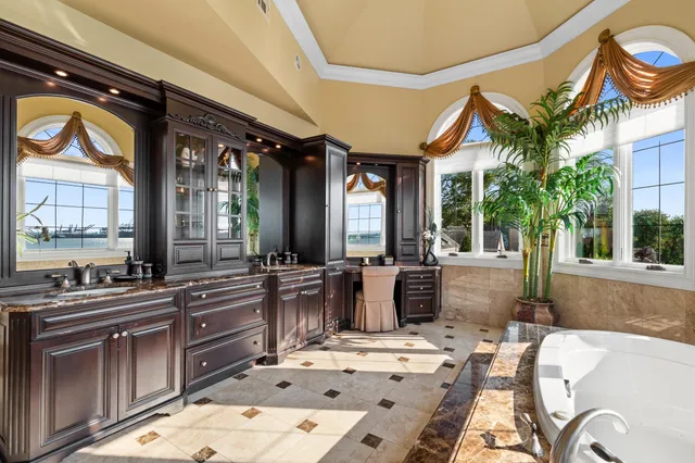 a large kitchen with a table and chairs