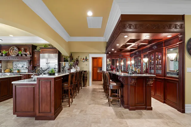 a view of a dining room with furniture and chandelier