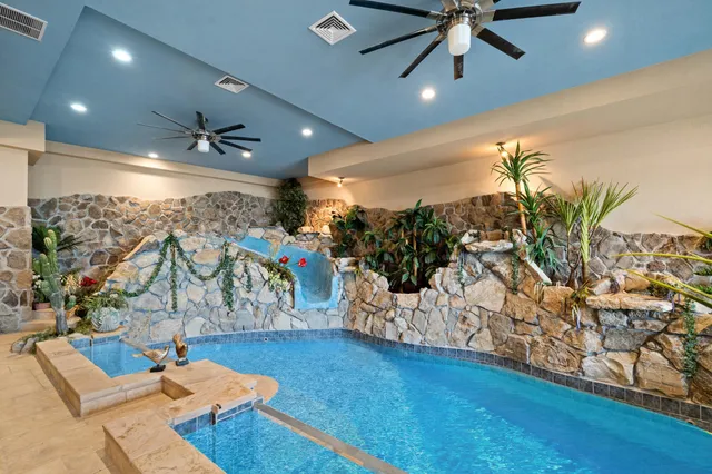a view of a livingroom with furniture and a potted plant