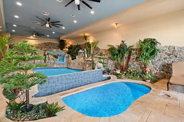 a view of a living room and kitchen