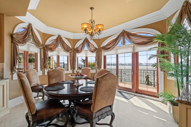 a view of a dining room with furniture window and outside view