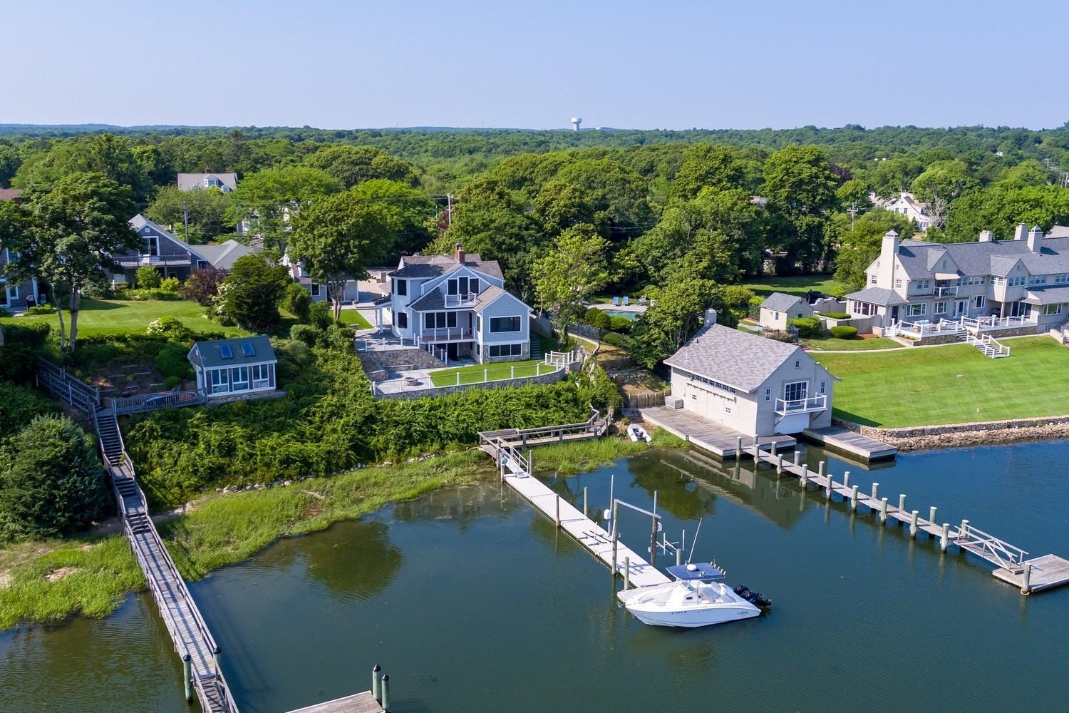 773 South Main Street Centerville, MA 02632 - Photo 1 of 33 an aerial view of a house with a lake view