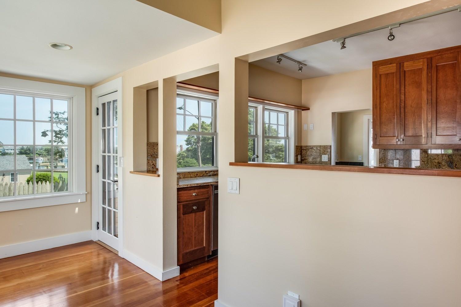 773 South Main Street Centerville, MA 02632 - Photo 14 of 33 a view of a kitchen with a fridge and wooden floor