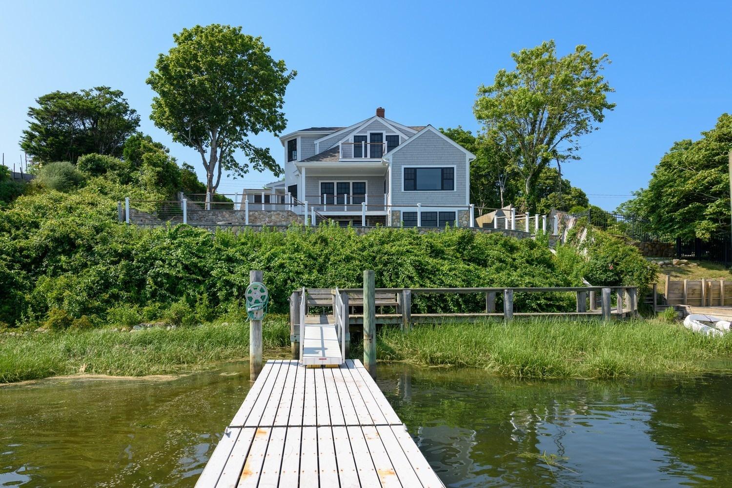 773 South Main Street Centerville, MA 02632 - Photo 3 of 33 a front view of a house with a yard