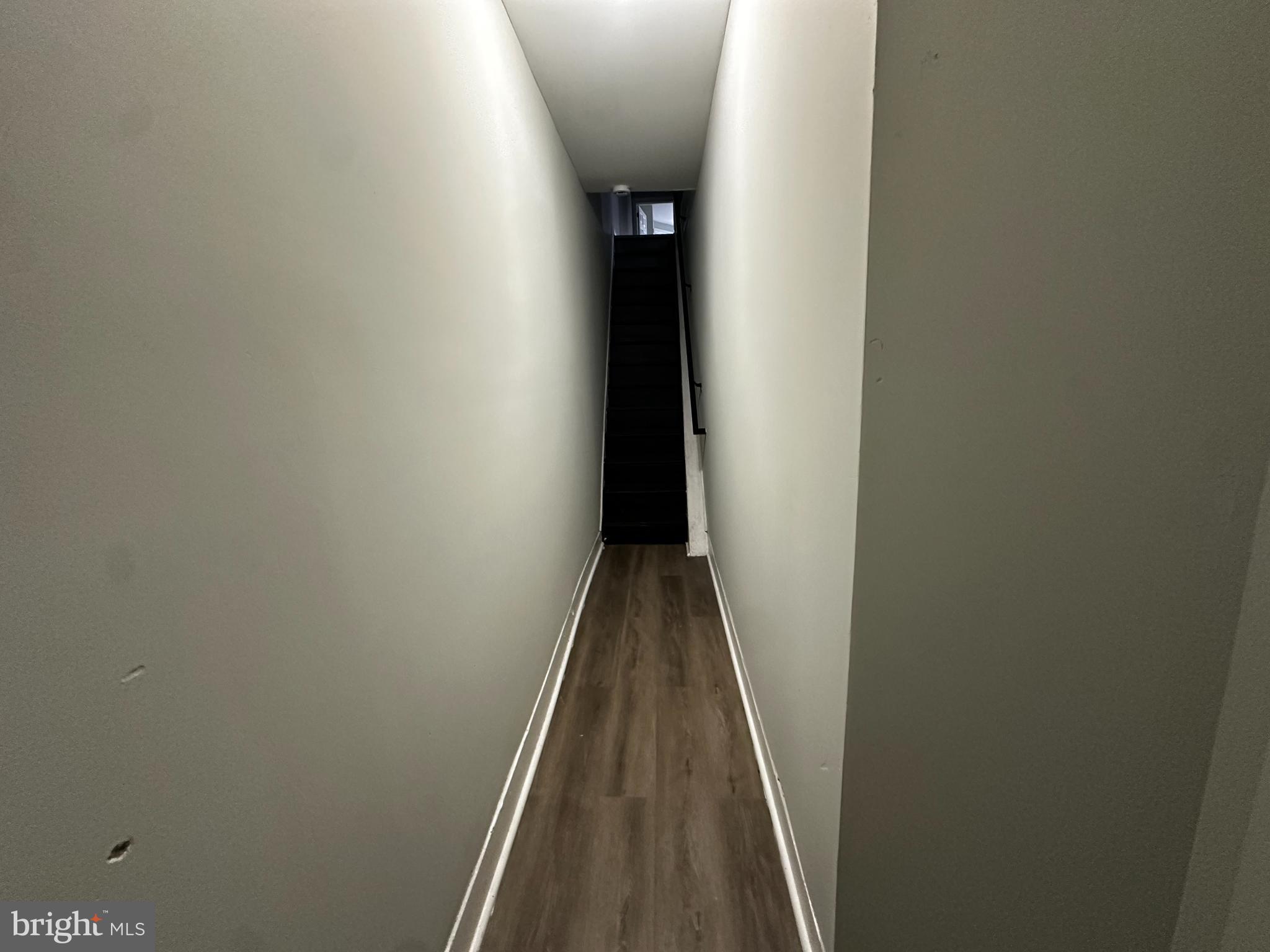 5729 Pine Street, Unit 2 Philadelphia, PA 19143 - Photo 17 of 21 a view of a hallway with wooden floor