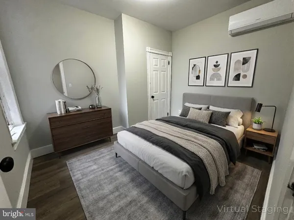 a bedroom with a bed and a dresser