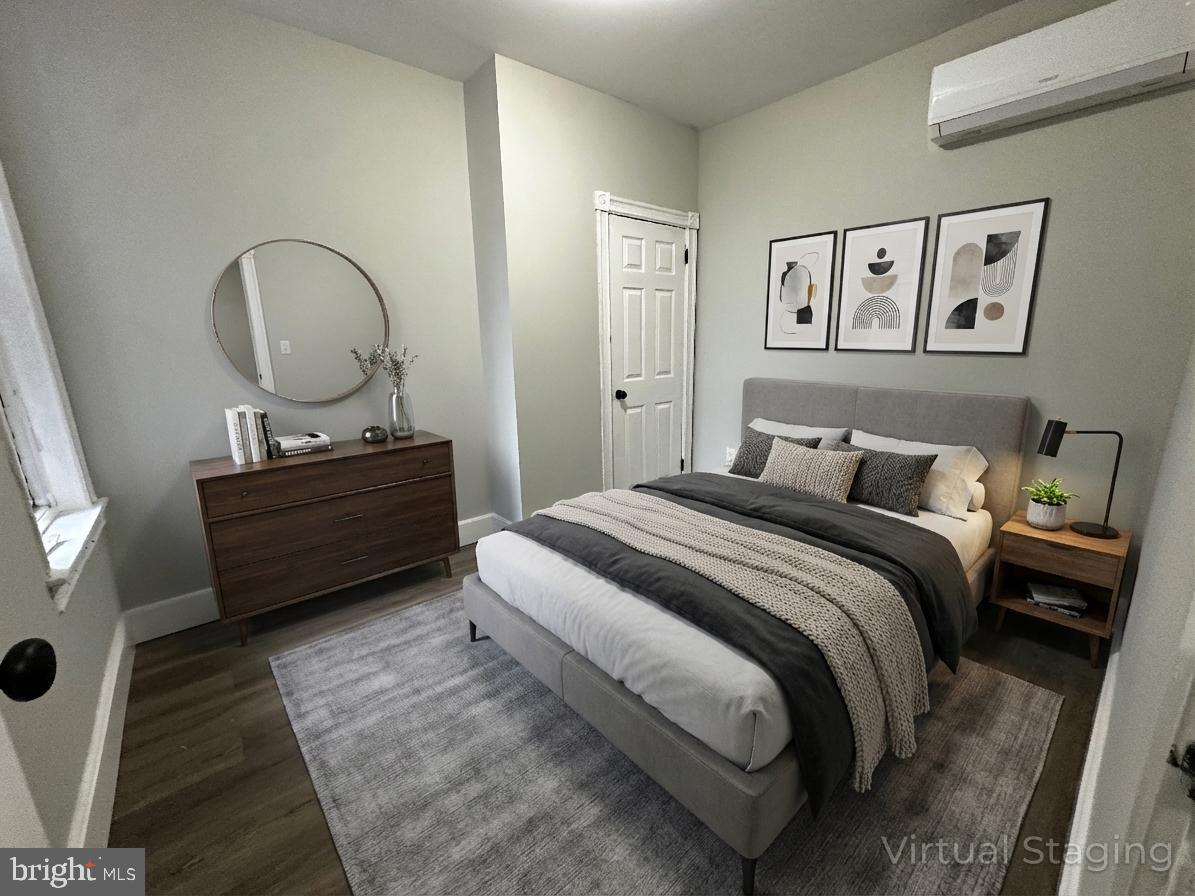 5729 Pine Street, Unit 2 Philadelphia, PA 19143 - Photo 3 of 21 a bedroom with a bed and a dresser