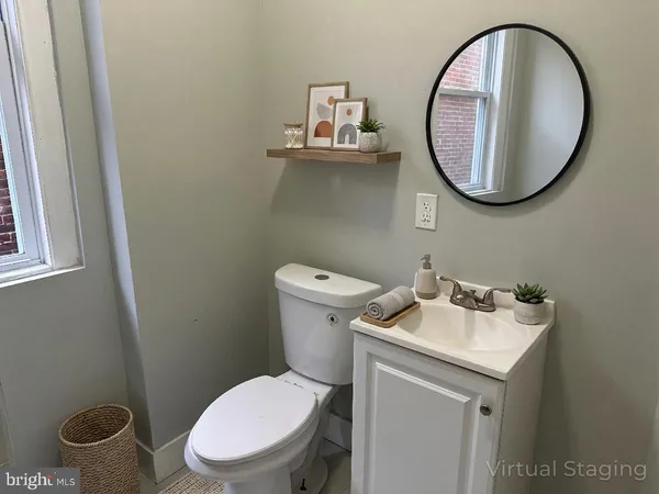 a bathroom with a toilet and a sink