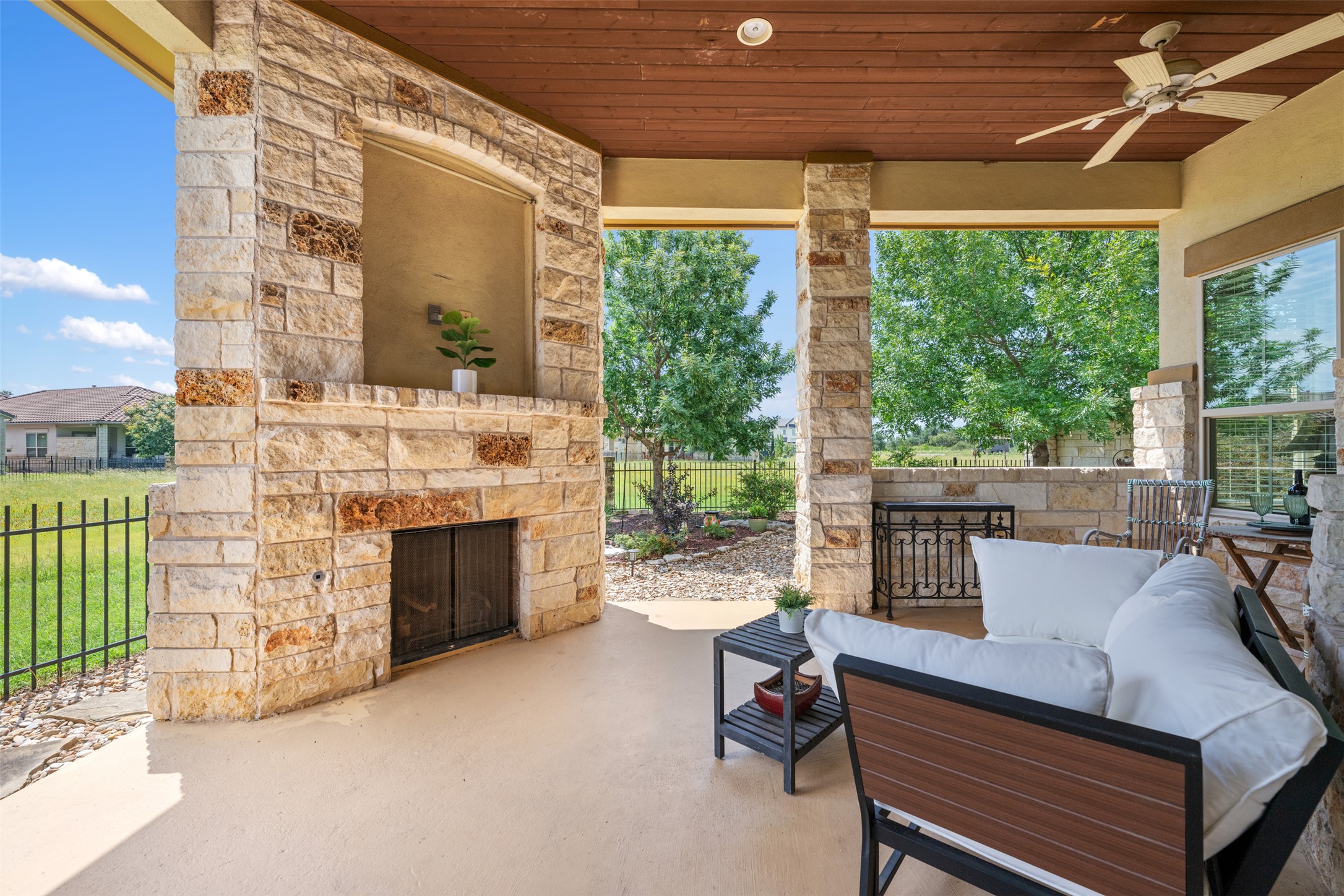 109 Limestone Drive Georgetown, TX 78628 - Photo 14 of 40 a outdoor space with patio the couches and a fireplace with the potted plants