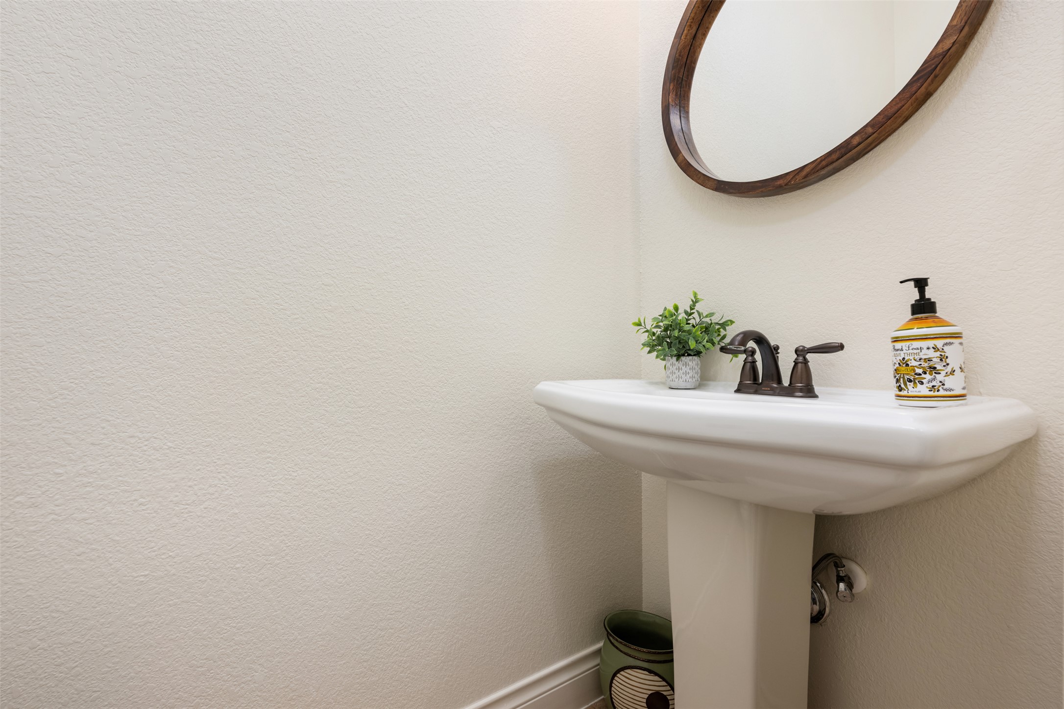109 Limestone Drive Georgetown, TX 78628 - Photo 26 of 40 a bathroom with a sink and a mirror