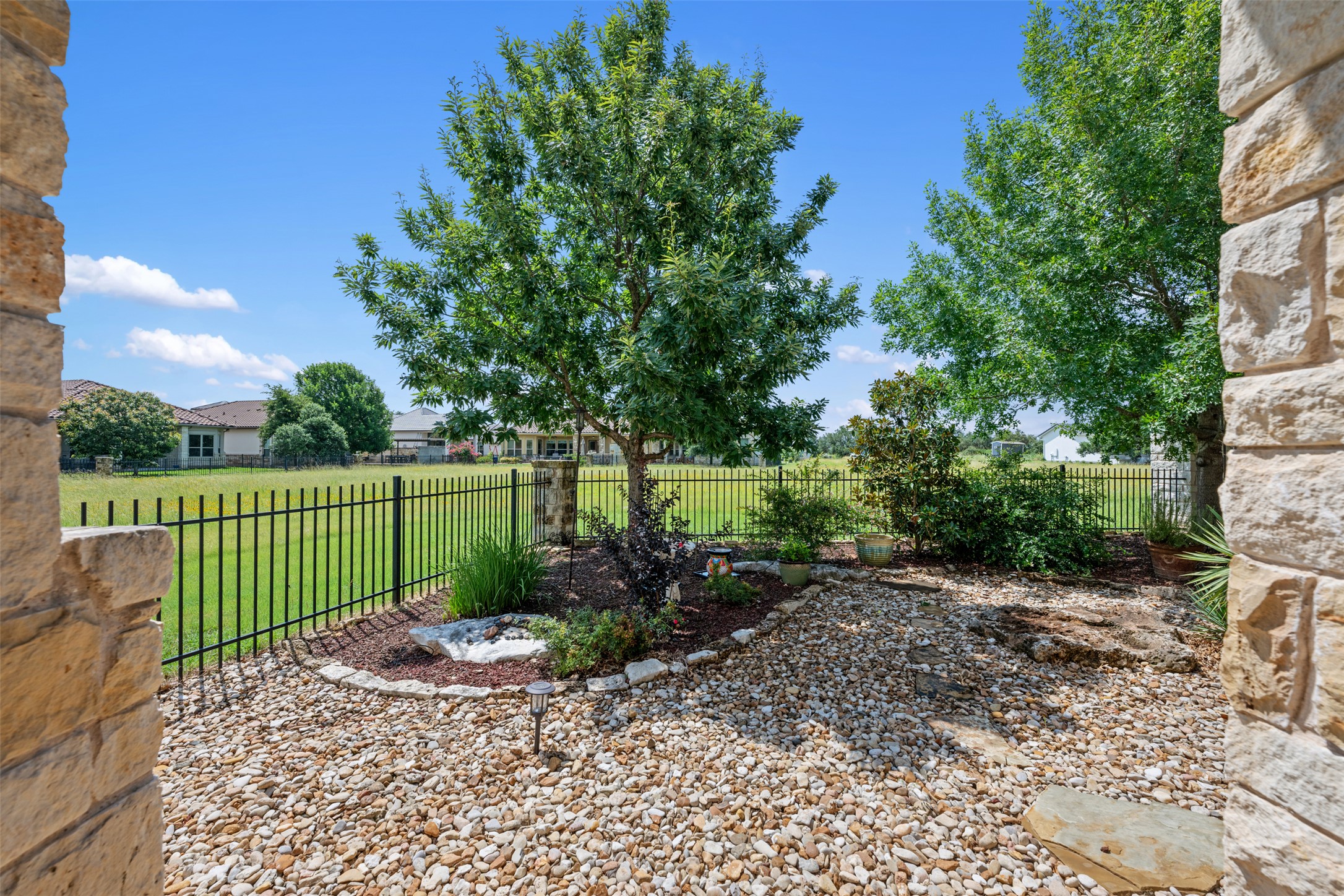 109 Limestone Drive Georgetown, TX 78628 - Photo 27 of 40 a view of a garden with a pathway