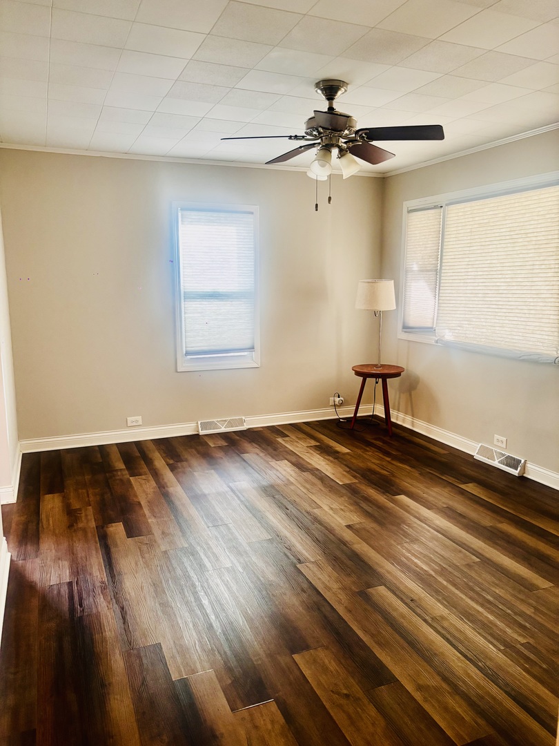 1514 173rd Street East Hazel Crest, IL 60429 - Photo 12 of 20 wooden floor in an empty room with a window