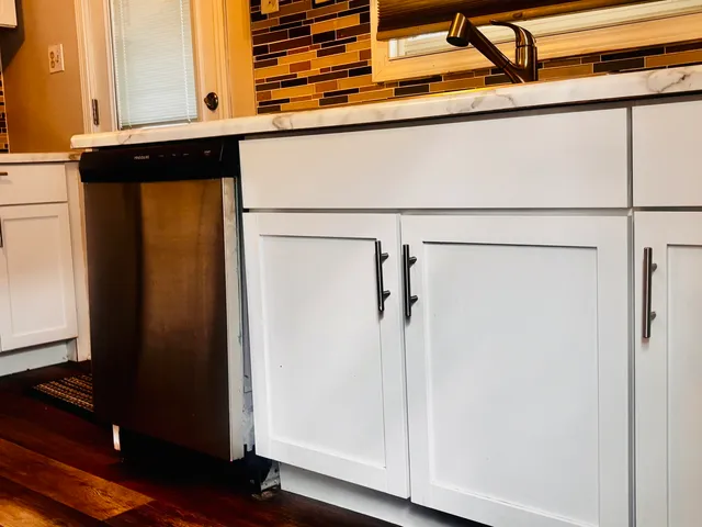 a kitchen with stainless steel appliances granite countertop a refrigerator sink and cabinets