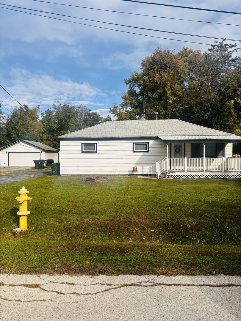 1514 173rd Street East Hazel Crest, IL 60429 - Photo 2 of 20 a front view of a house with a yard