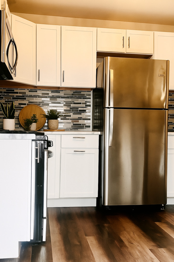 1514 173rd Street East Hazel Crest, IL 60429 - Photo 9 of 20 a kitchen with stainless steel appliances a refrigerator and a stove top oven