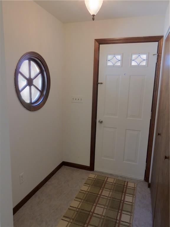 7111 Country Club Road Butler, PA 16001 - Photo 19 of 25 an empty room with wooden floor and a window