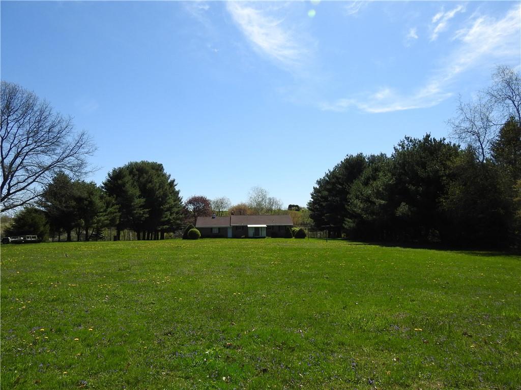 7111 Country Club Road Butler, PA 16001 - Photo 24 of 25 a view of a green field with trees in the background