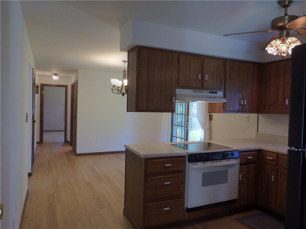 7111 Country Club Road Butler, PA 16001 - Photo 8 of 25 a kitchen with granite countertop cabinets and steel stainless steel appliances